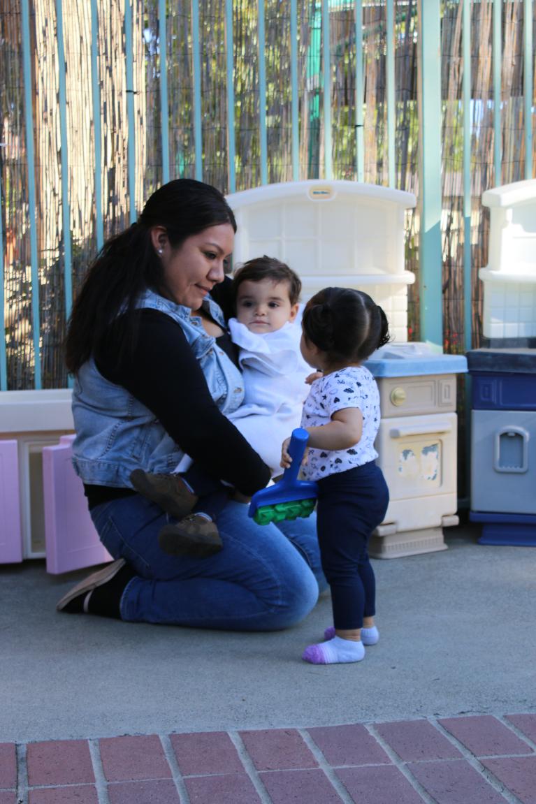Infant Care Educator with two infants